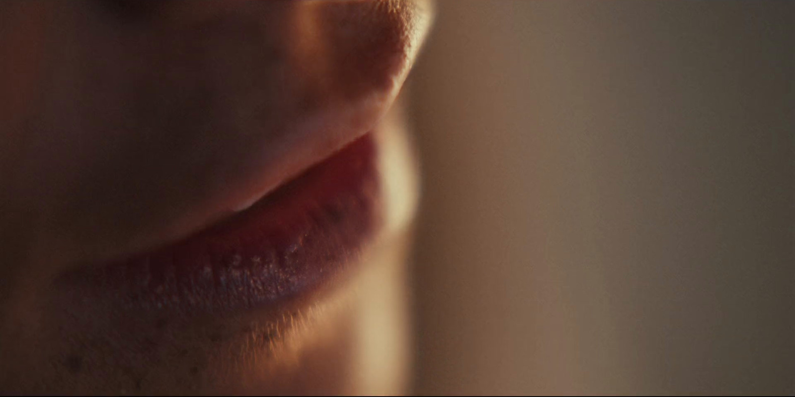 a close up of a person's lips with a blurry background