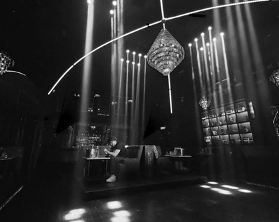 a black and white photo of a stage with lights