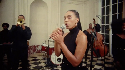 a woman standing in front of a microphone