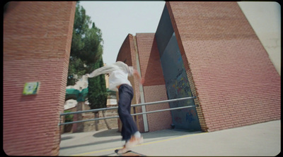 a man riding a skateboard down a metal rail