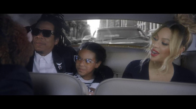 a group of people sitting in the back of a car