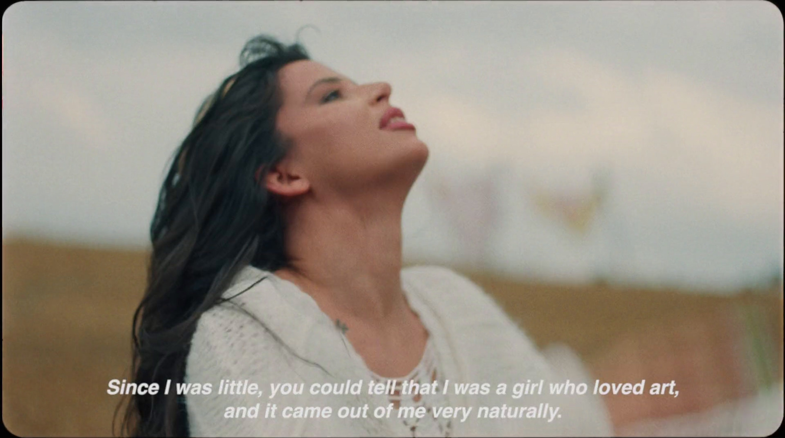 a woman with long black hair and a quote on it