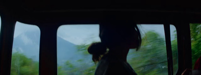 a blurry photo of a woman in a bus