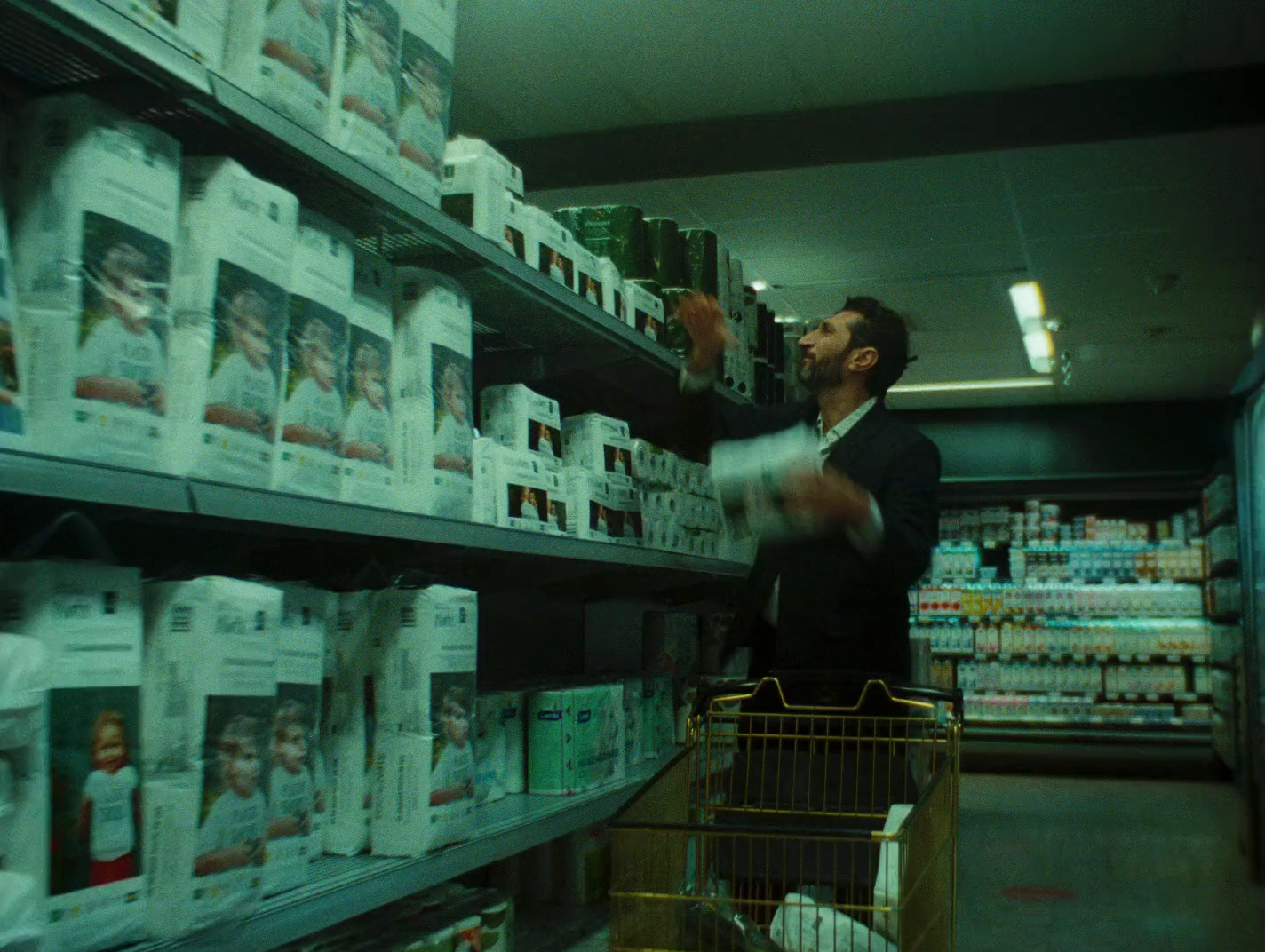 a man standing in a grocery store aisle