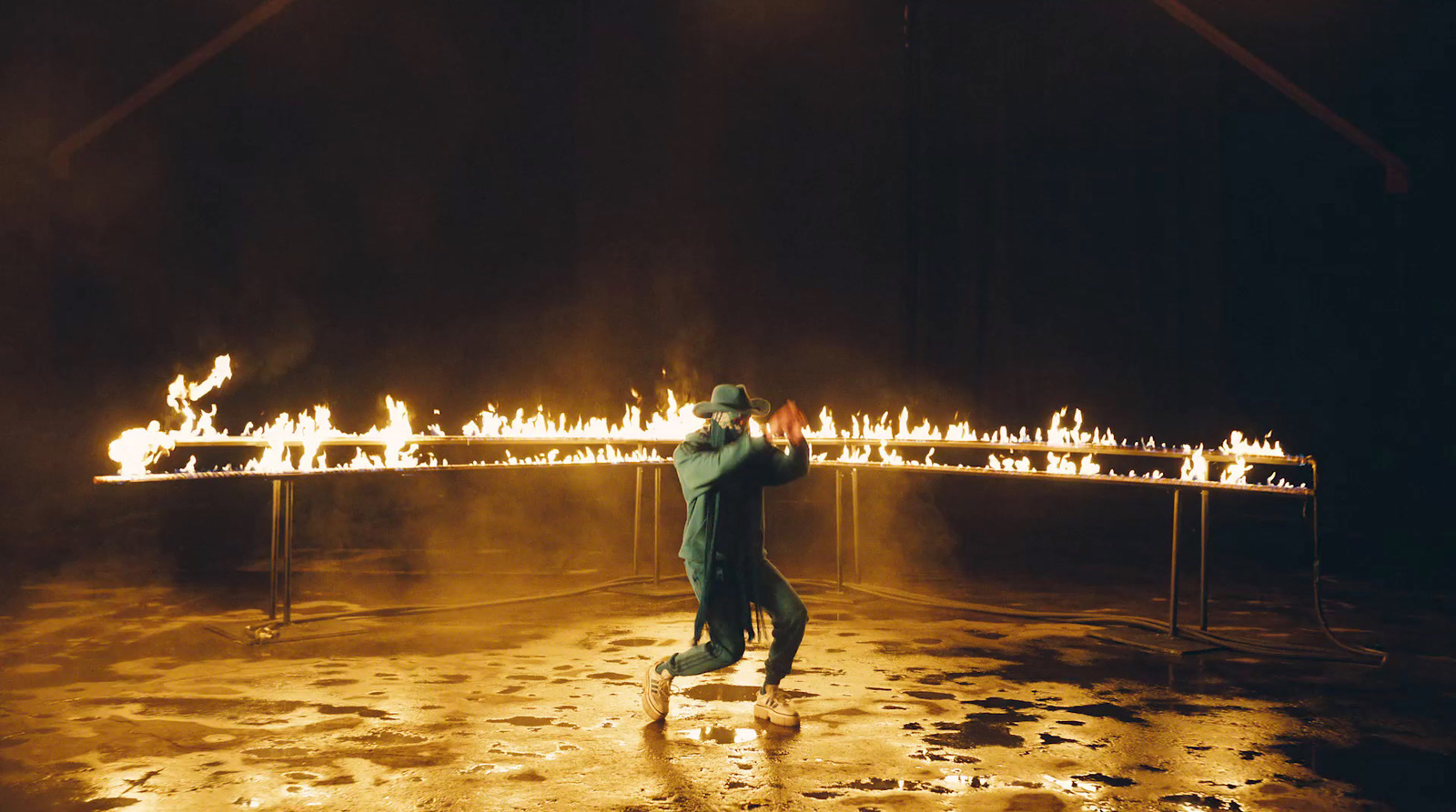 a man standing in front of a fire display