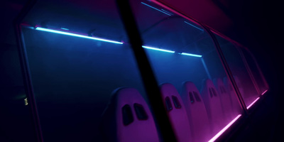 a row of ghost shaped windows in a dark room