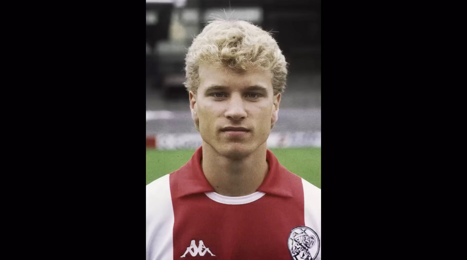 a young man in a red and white uniform