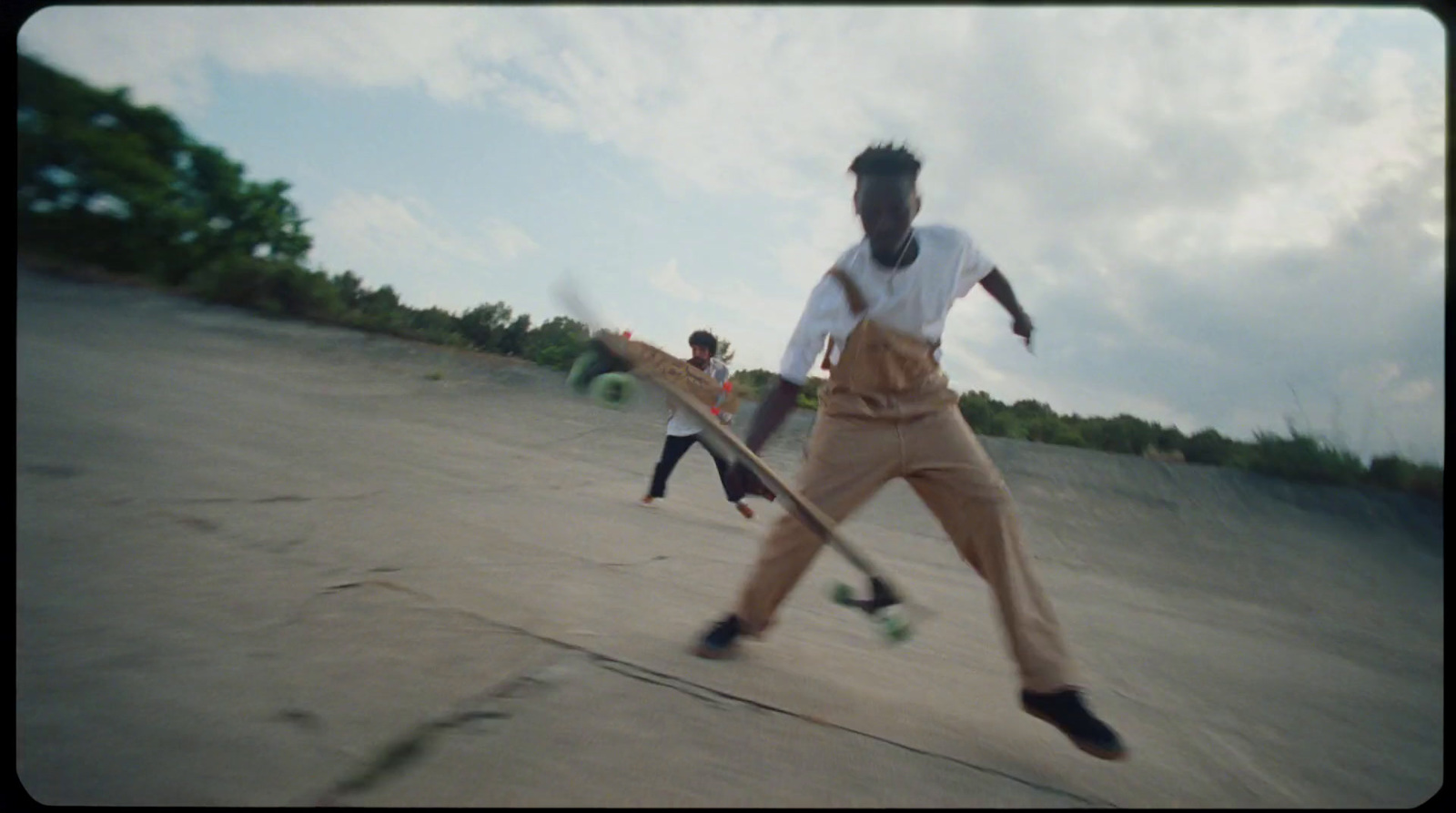 a group of young men riding skateboards on top of cement