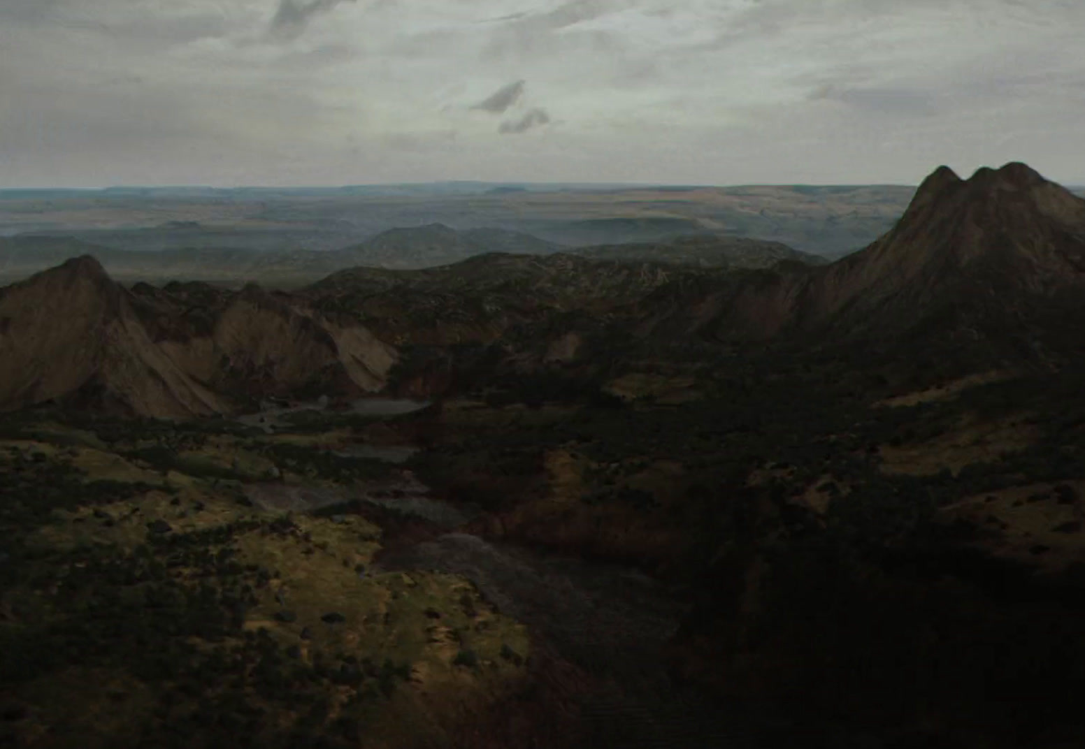 a view of a mountain range with a river running through it