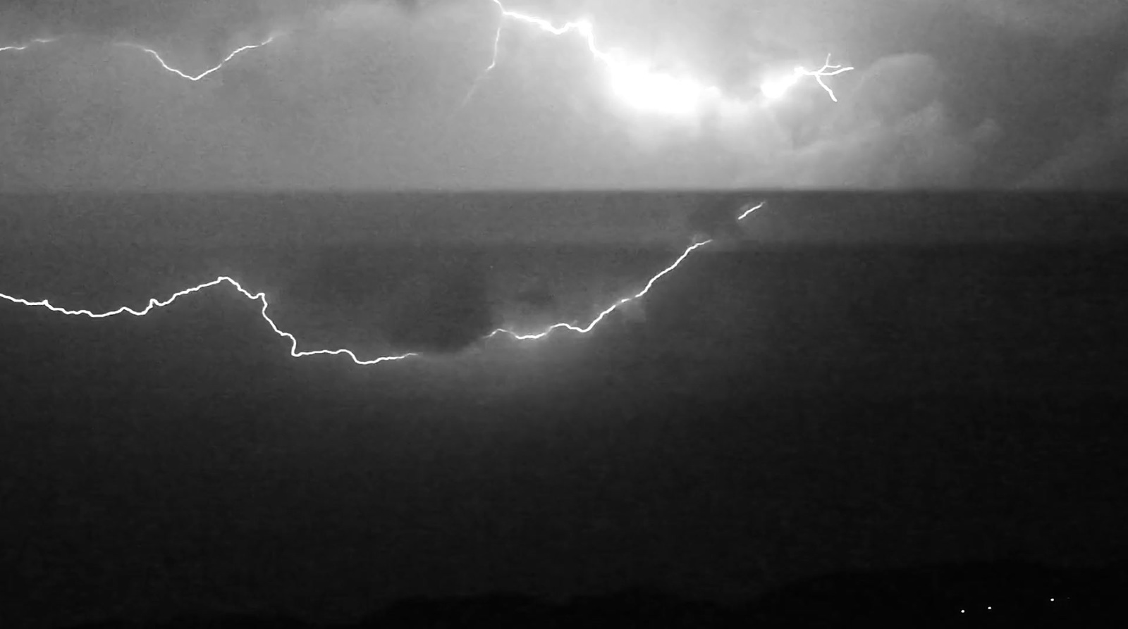 a black and white photo of a lightning bolt