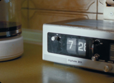 a close up of a clock on a table