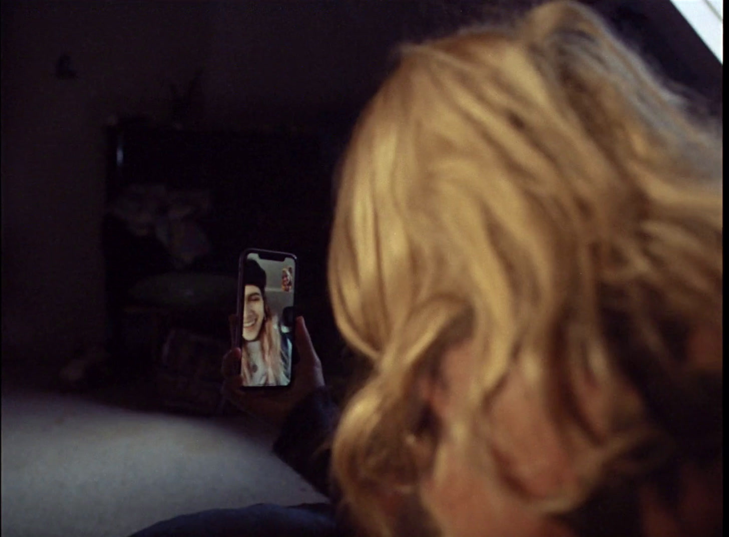 a woman taking a picture of herself in a mirror