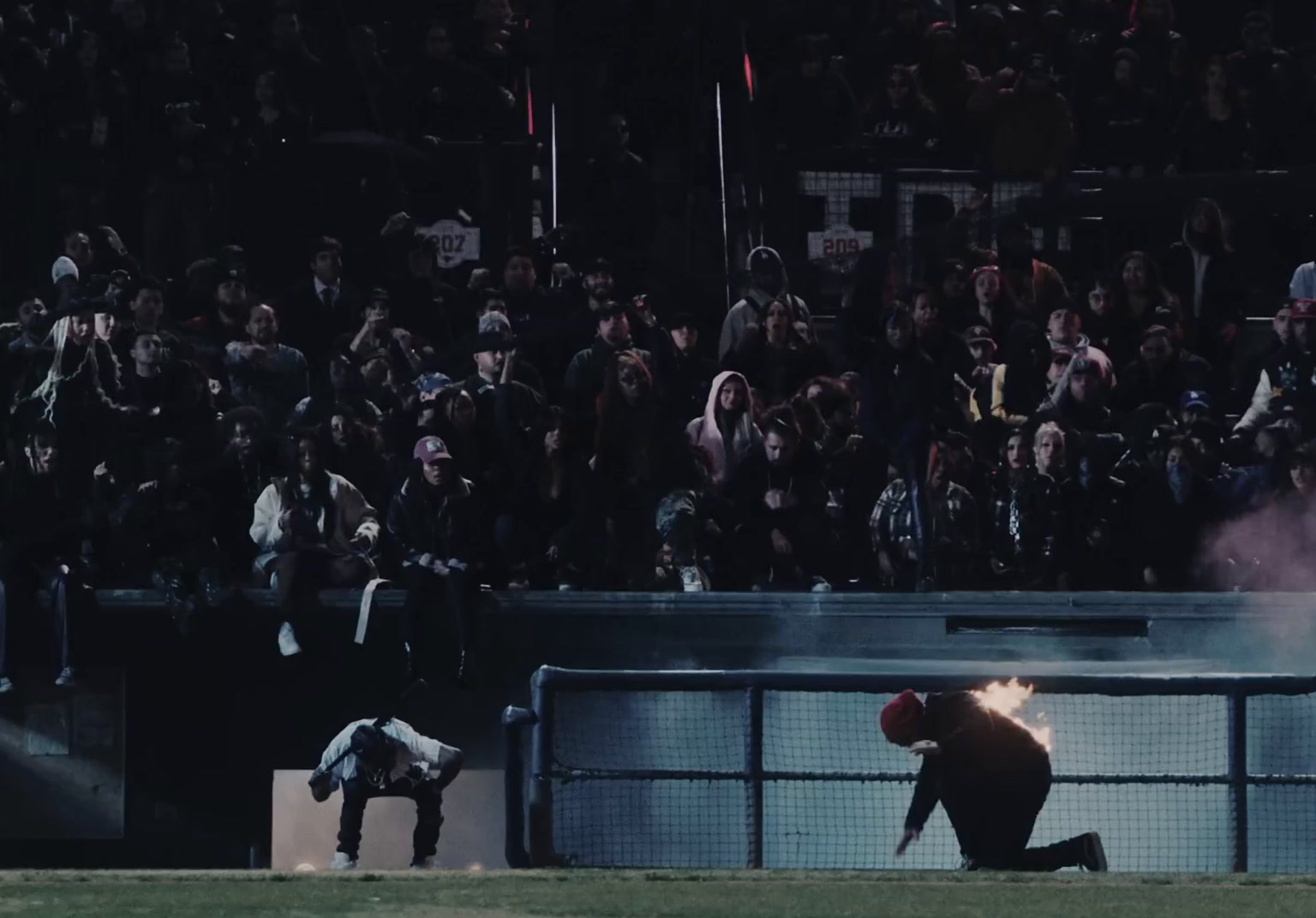 a crowd of people watching a baseball game