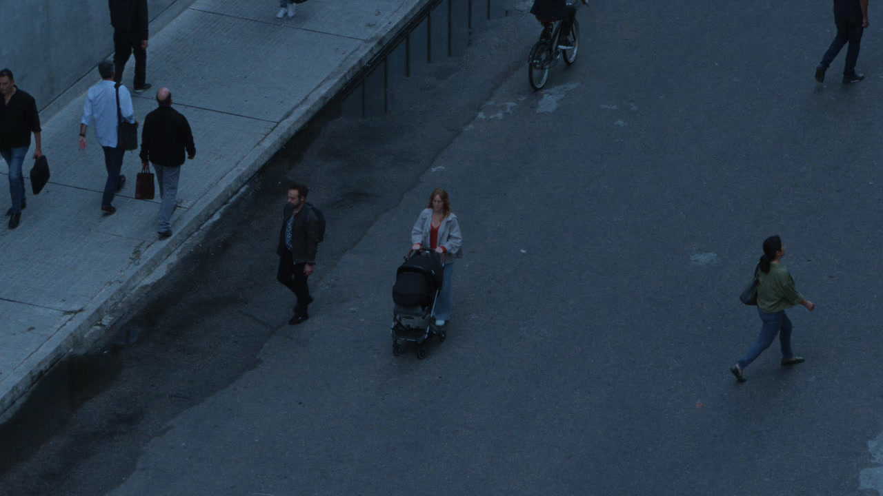 a group of people walking down a street