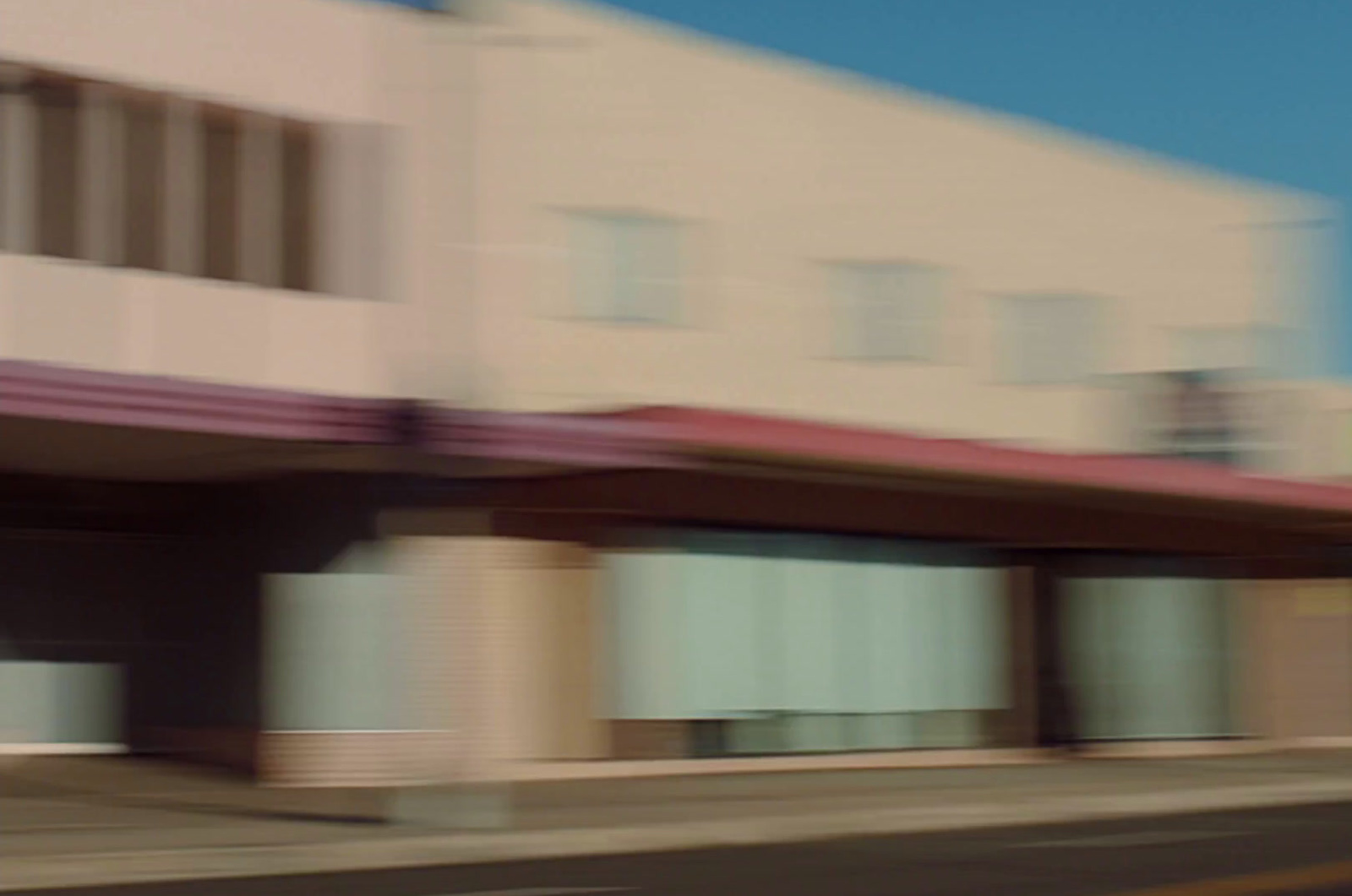 a blurry photo of a building and a street