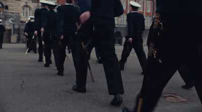 a group of men walking down a street