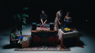 a group of people standing around a table