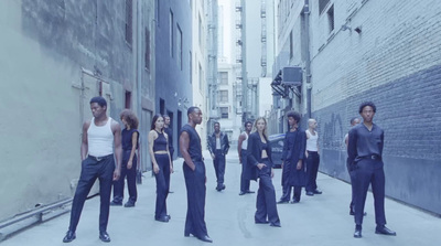 a group of people standing in an alley