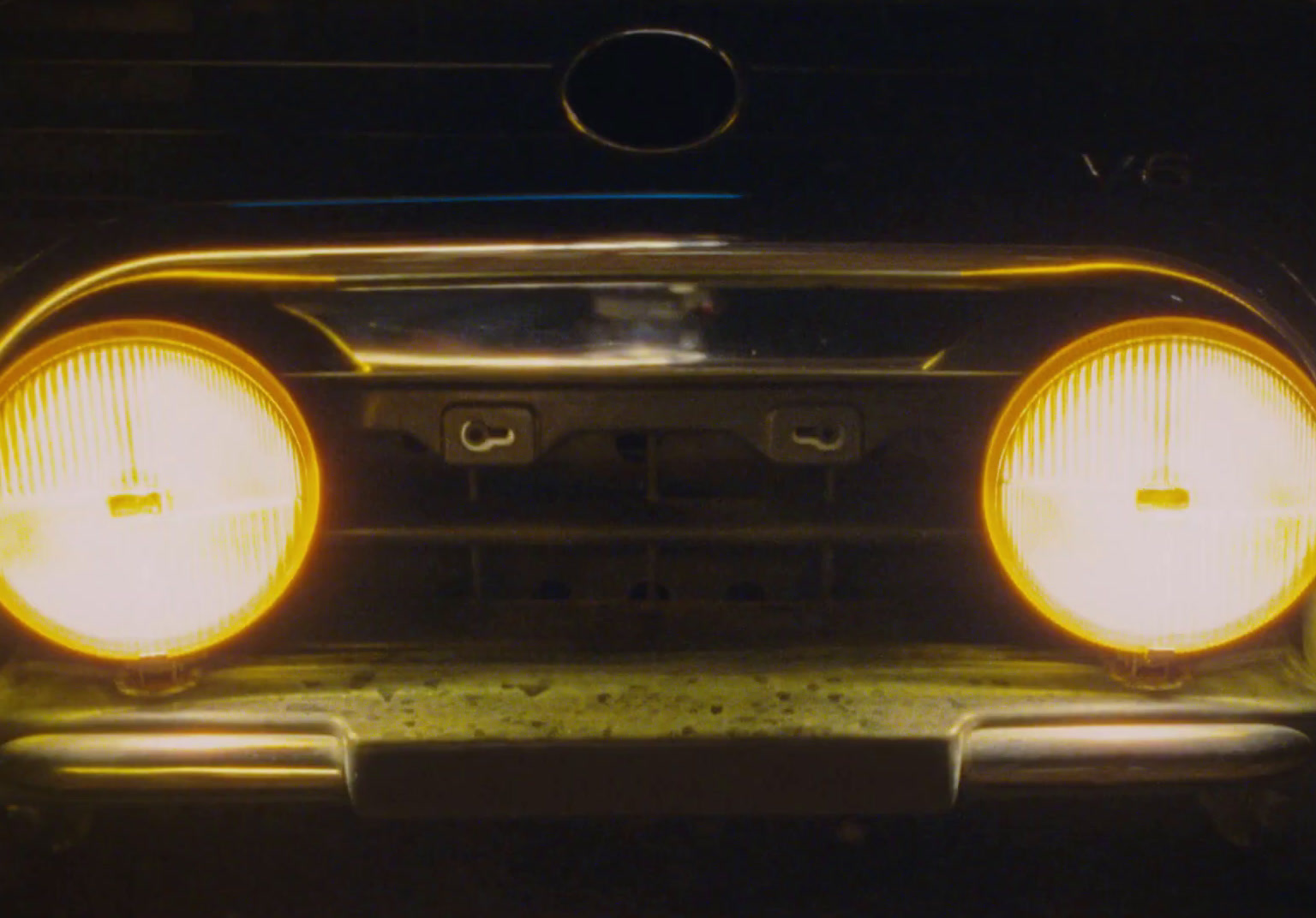 a close up of the headlights of a car