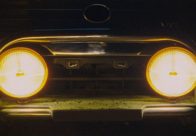 a close up of the headlights of a car