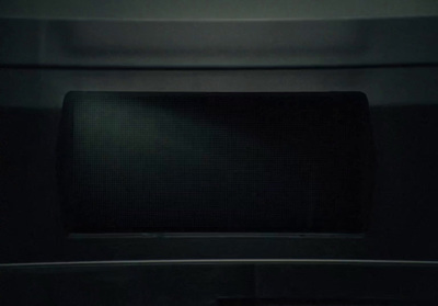 a black microwave oven with the door open