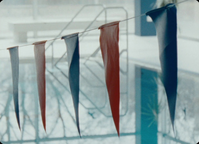 a red white and blue flag is hanging outside