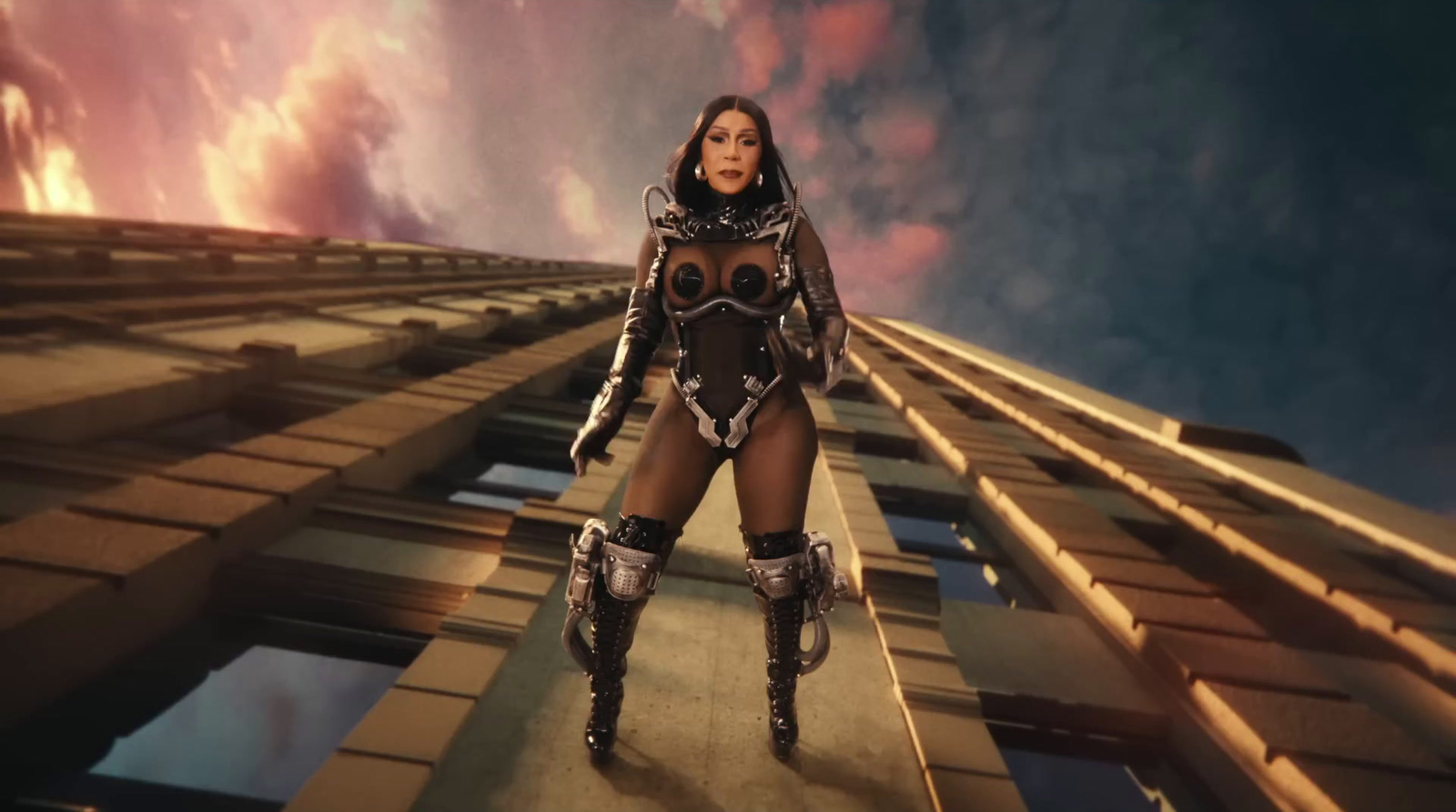 a woman in a futuristic suit standing on a platform