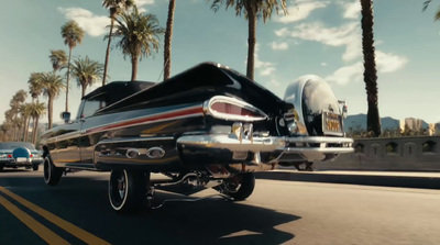 a black and silver motorcycle driving down a street