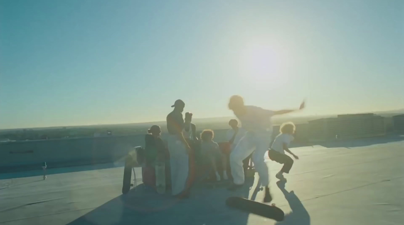 a group of people standing on top of a roof