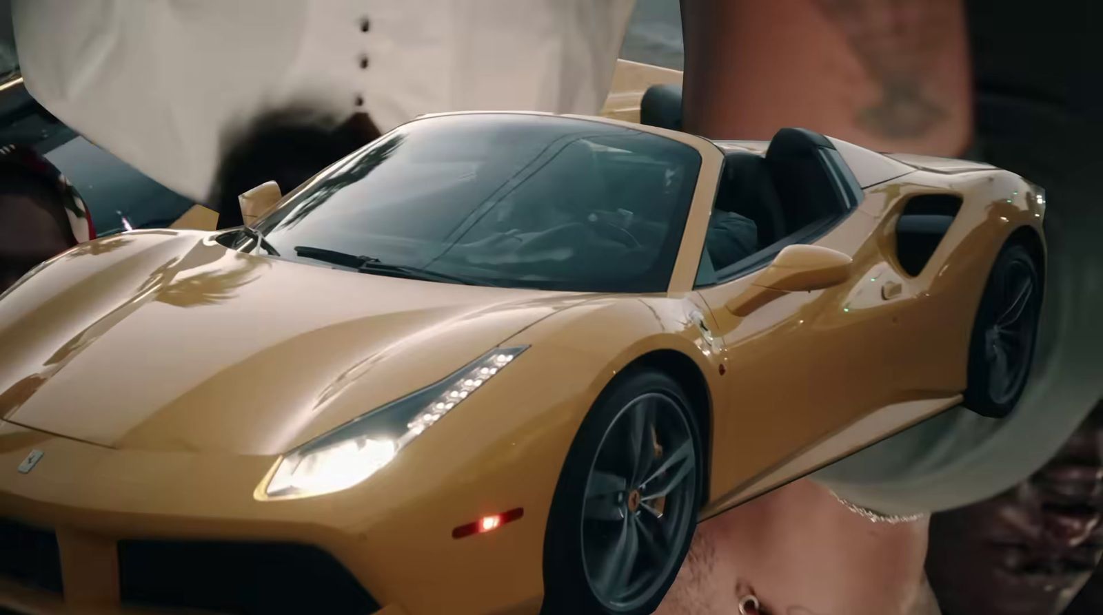 a close up of a yellow sports car