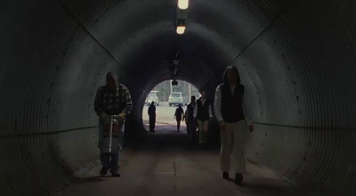 a group of people standing in a tunnel