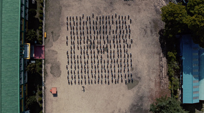 an aerial view of a parking lot with a lot of parked cars