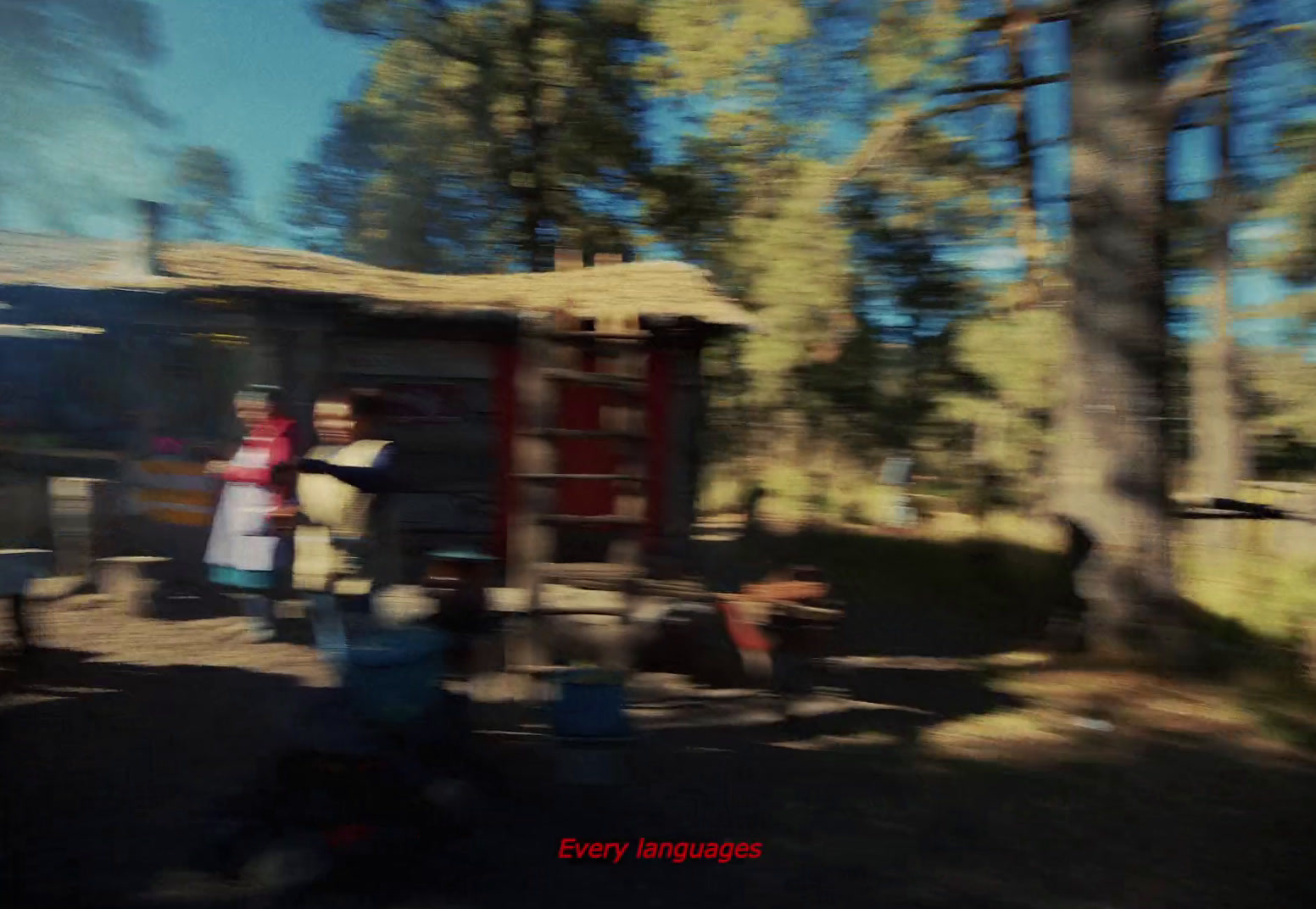 a blurry photo of people standing in front of a cabin