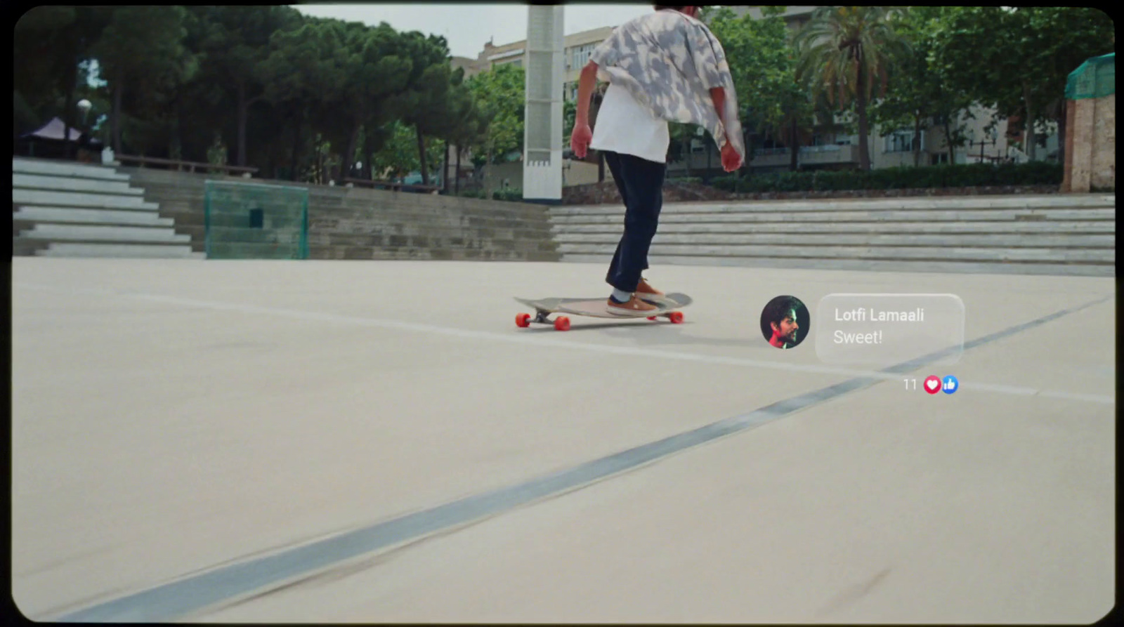 a man riding a skateboard down a street