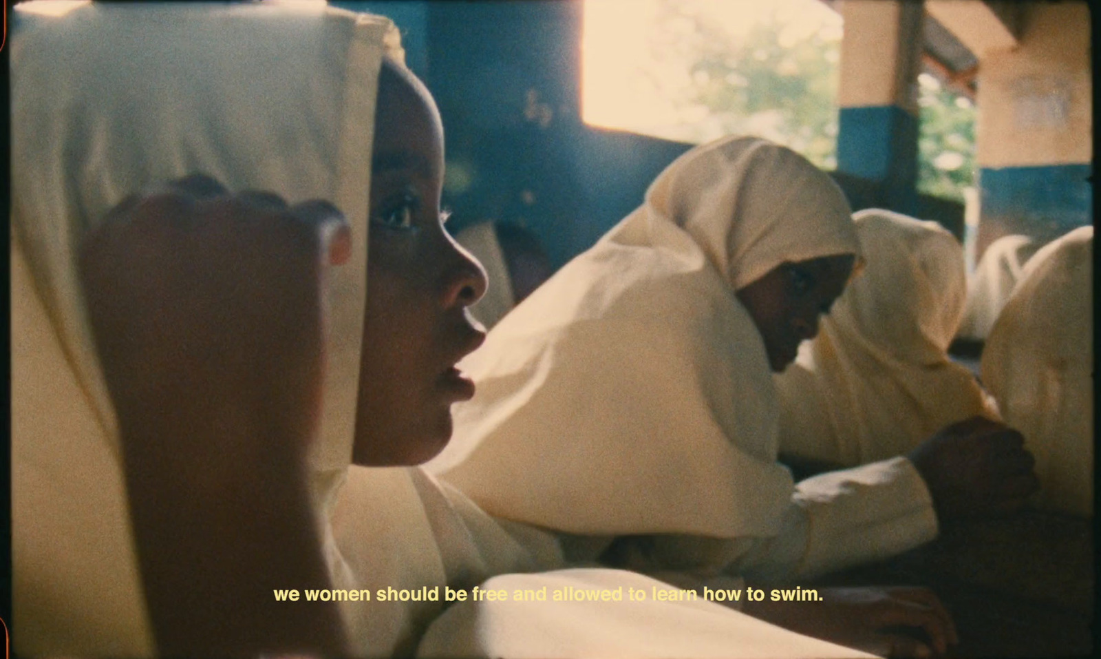 a group of women sitting next to each other