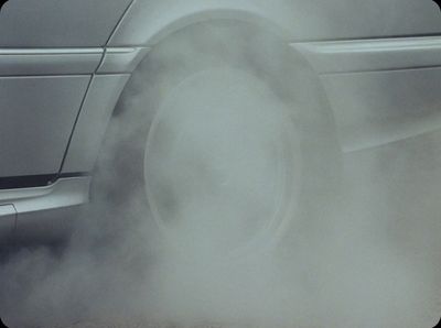 a close up of a car with a lot of smoke coming out of it