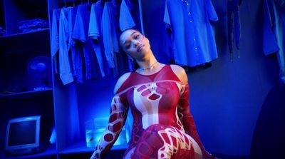 a woman in a red and white dress in a room