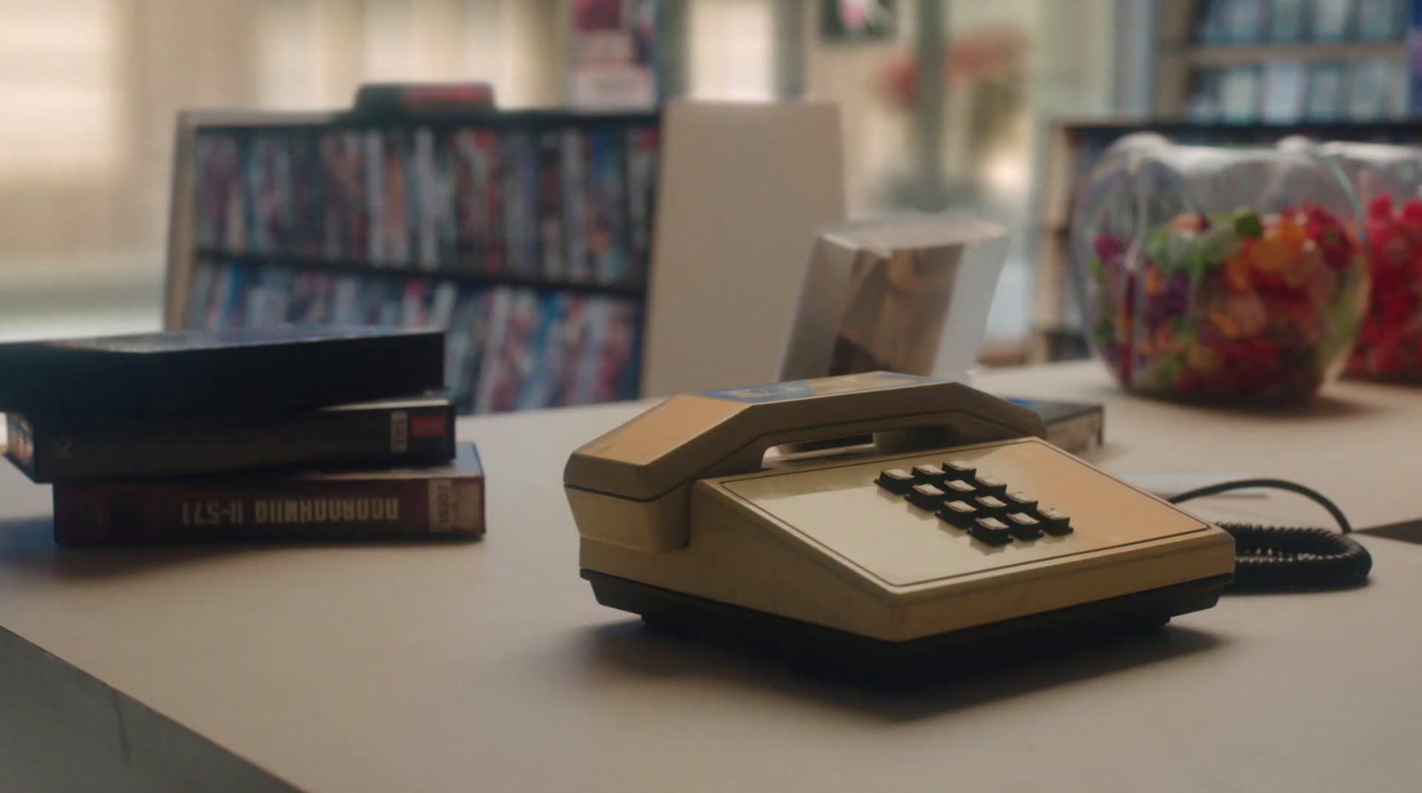 a phone sitting on top of a table in a library