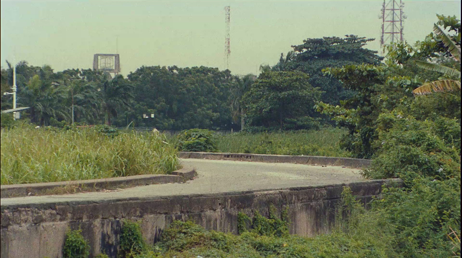 a man riding a skateboard down a cement ramp