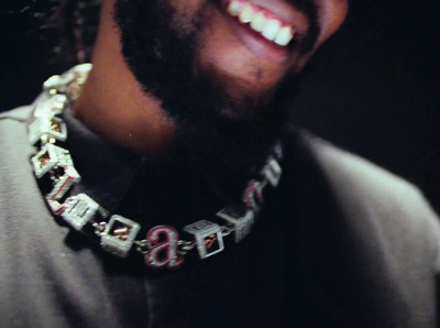 a close up of a person wearing a necklace