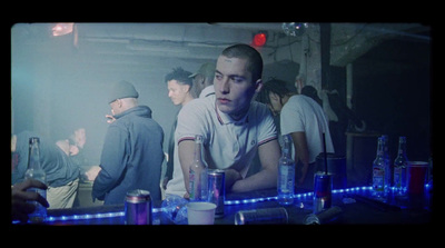 a group of people standing around a bar