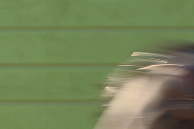 a blurry image of a baseball player holding a bat