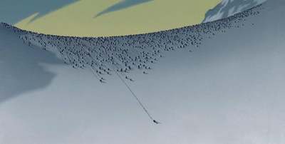 a man riding skis down a snow covered slope