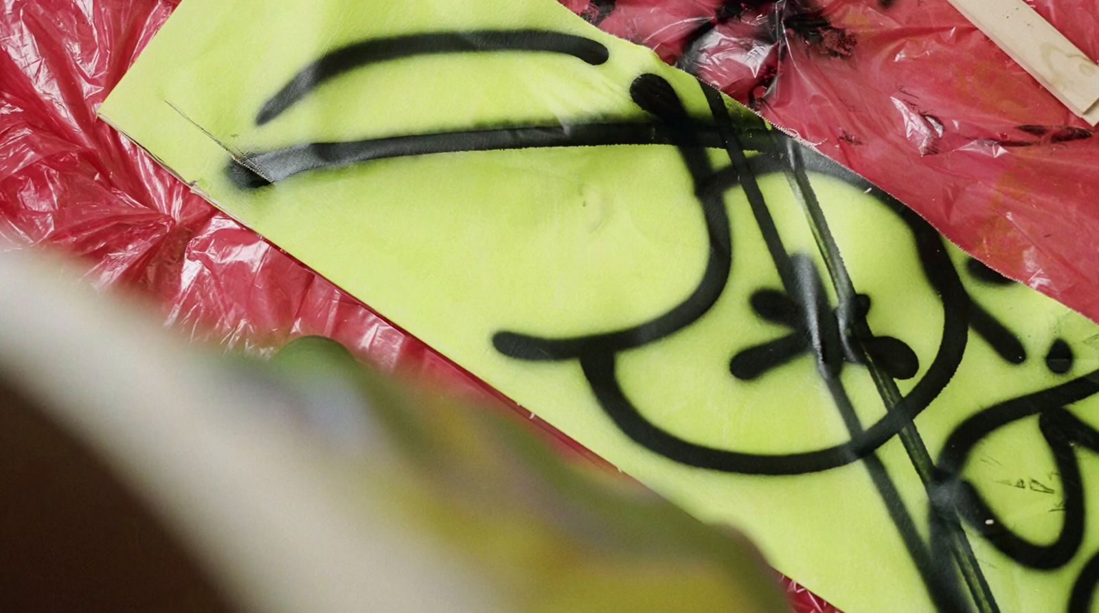 a close up of a kite with black writing on it