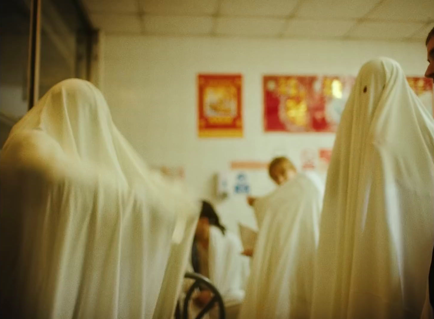 a group of people dressed in ghost costumes