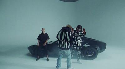 a group of people standing around a car