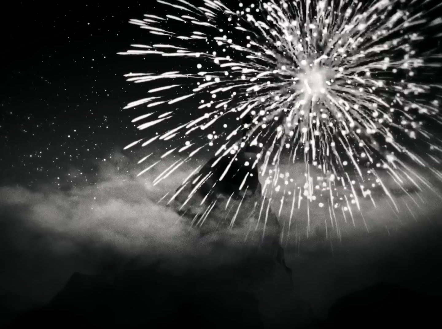 a black and white photo of a fireworks