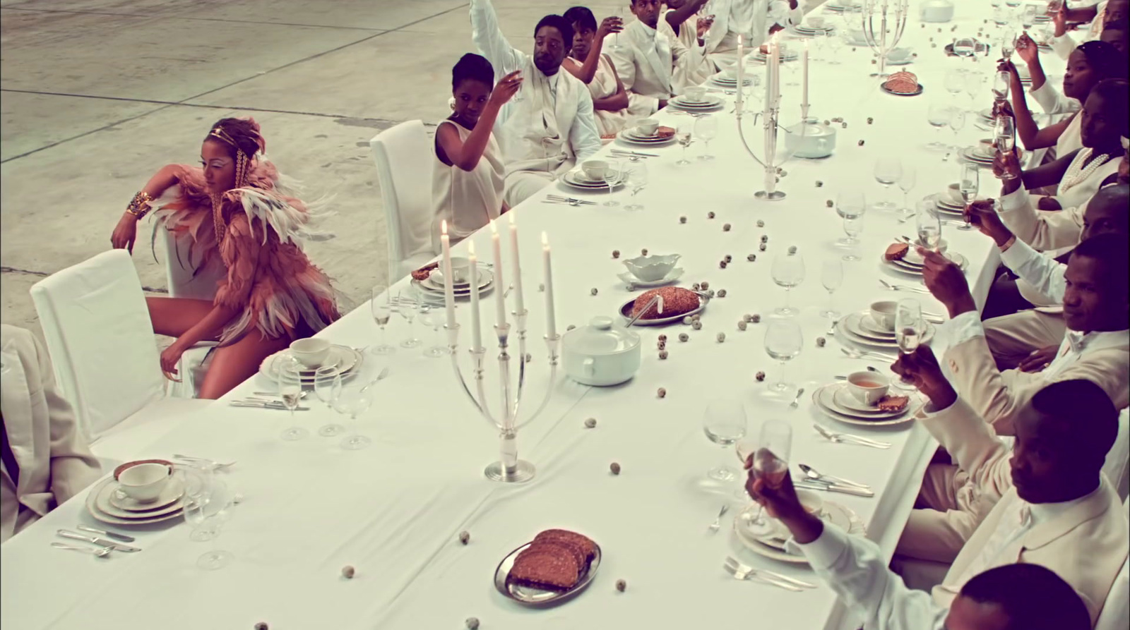 a group of people sitting at a long table