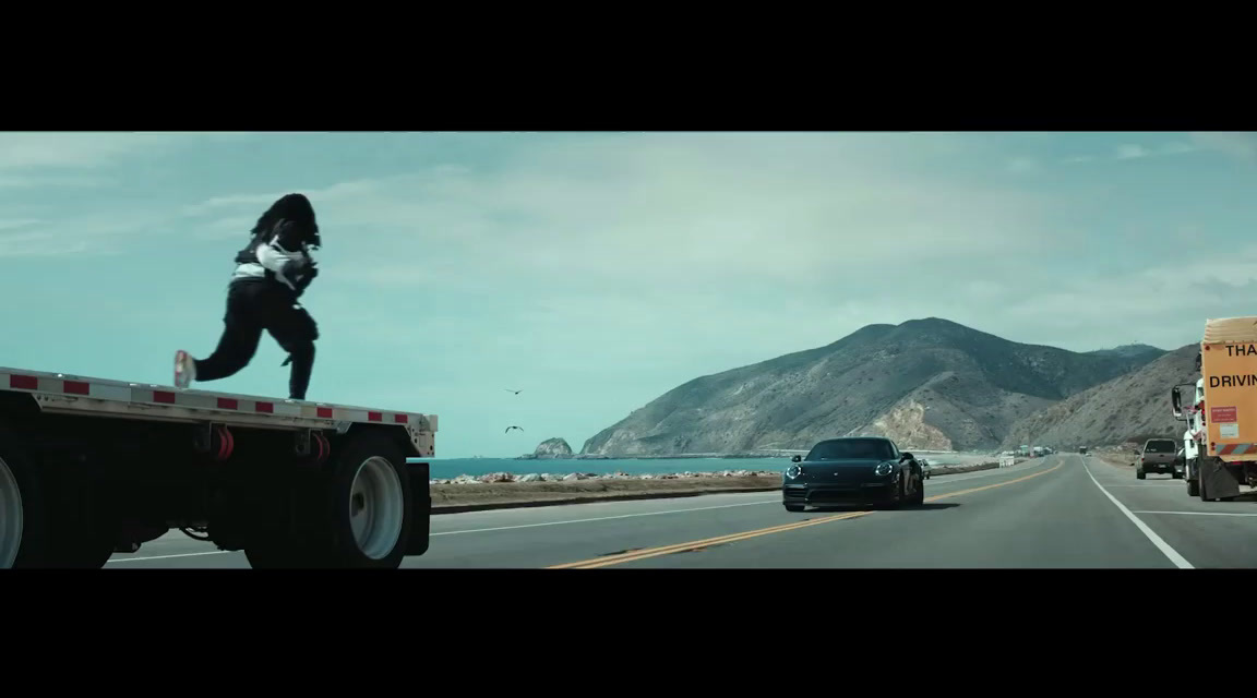 a woman running on the back of a truck