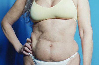 a woman in a bikini posing for a picture